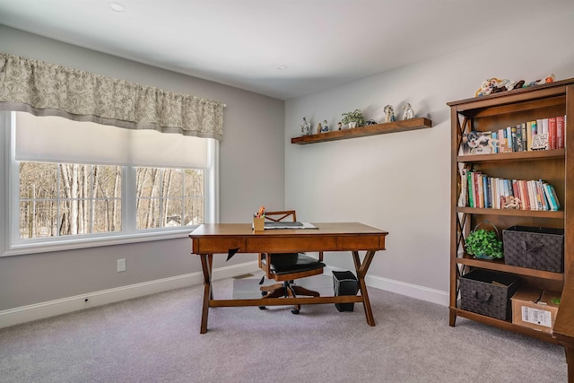 home office with baseboards and carpet floors