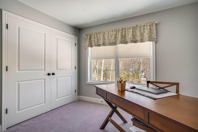 office with light colored carpet and baseboards