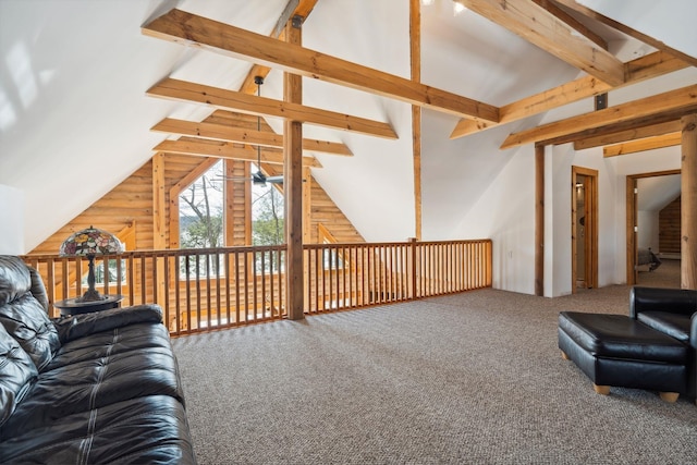 living area with vaulted ceiling with beams, a ceiling fan, and carpet floors