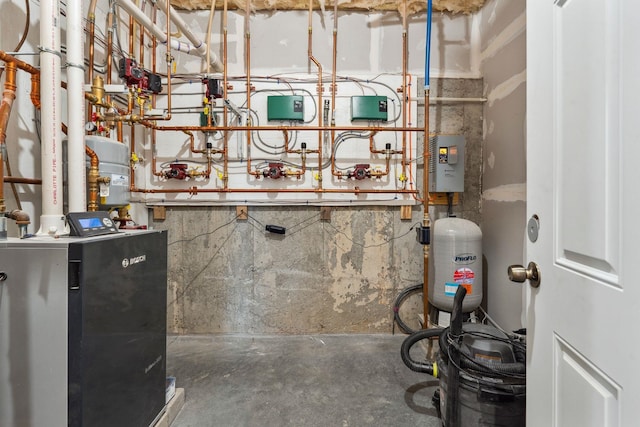 utility room featuring a heating unit