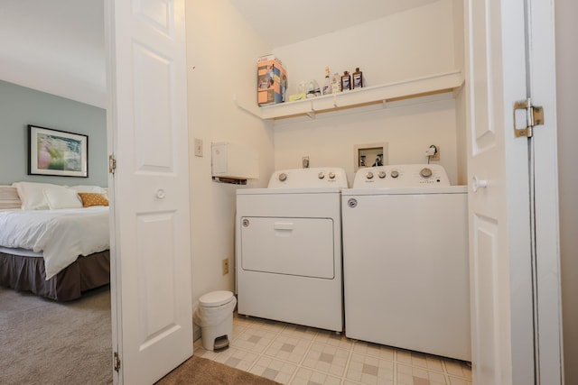 washroom with laundry area and washer and clothes dryer