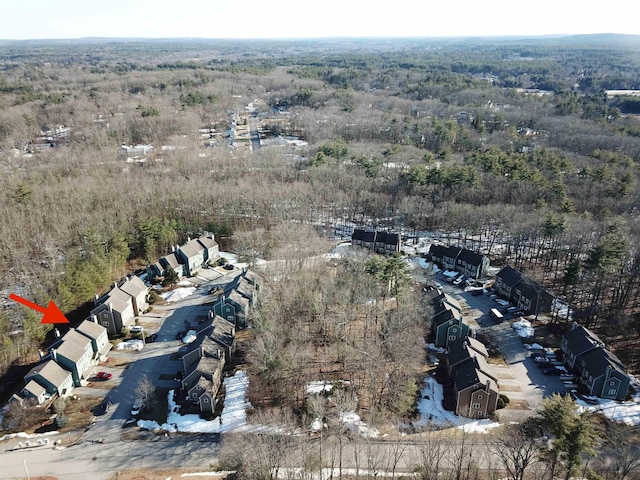 drone / aerial view featuring a view of trees