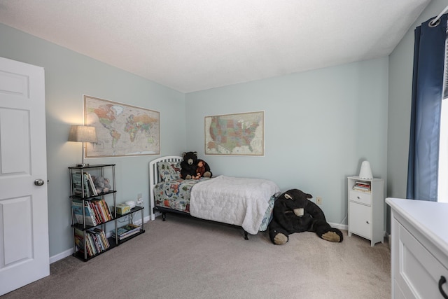 carpeted bedroom with baseboards