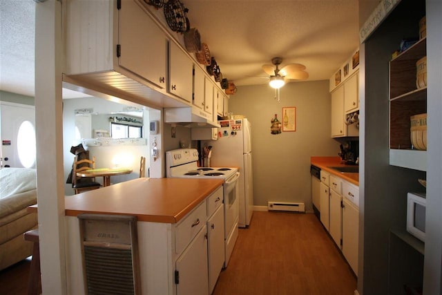 kitchen featuring light wood finished floors, ceiling fan, under cabinet range hood, white appliances, and a baseboard radiator