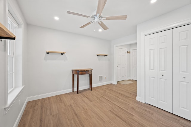 unfurnished bedroom featuring recessed lighting, baseboards, and light wood finished floors