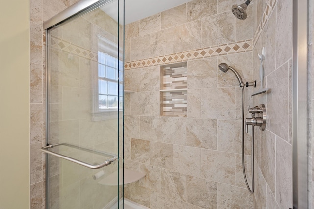 full bathroom featuring tiled shower