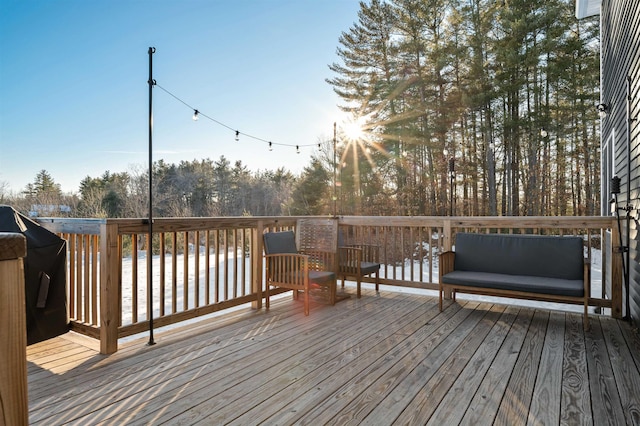 wooden deck with grilling area