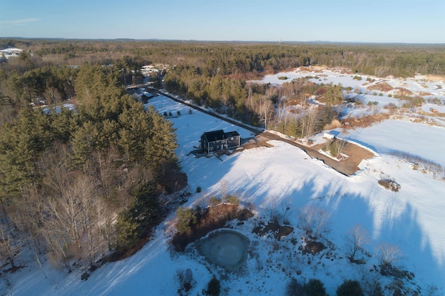 snowy aerial view with a view of trees