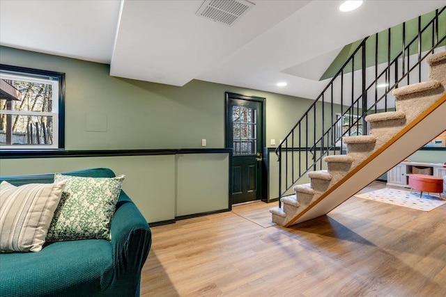 interior space with recessed lighting, visible vents, baseboards, and wood finished floors