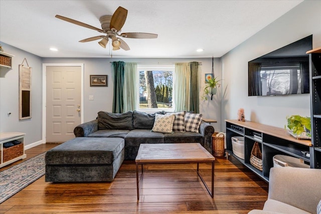 living area featuring ceiling fan, baseboards, dark wood finished floors, and recessed lighting