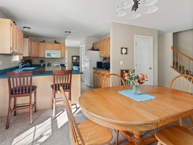 dining area featuring stairway