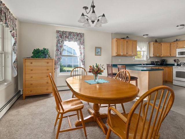 dining space featuring a notable chandelier, light colored carpet, and a baseboard radiator