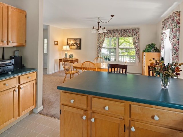 kitchen featuring light colored carpet