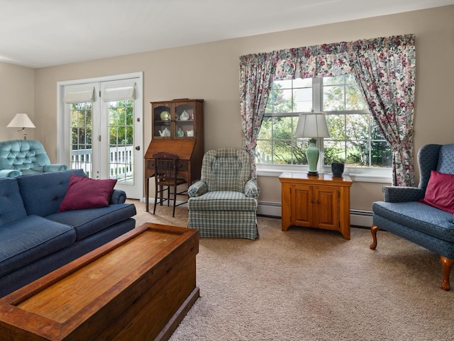 living area with baseboard heating and light colored carpet