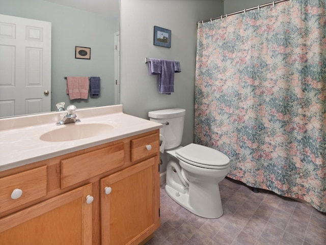 bathroom with toilet and vanity