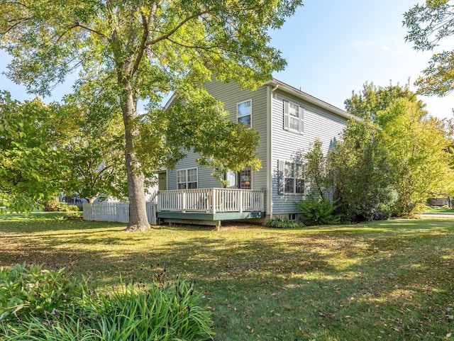 exterior space featuring a lawn and a wooden deck