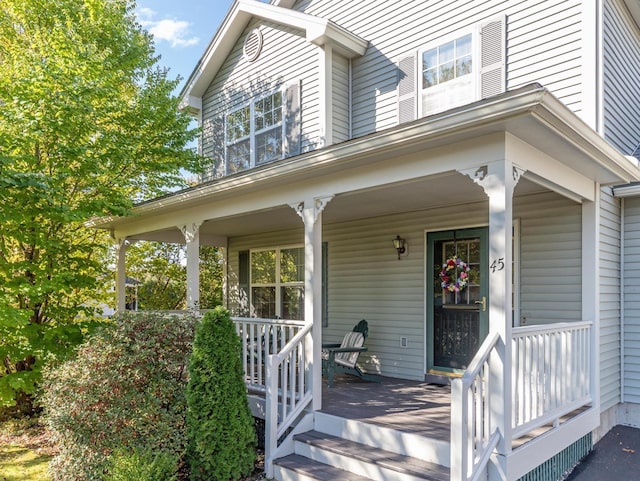 view of exterior entry with covered porch