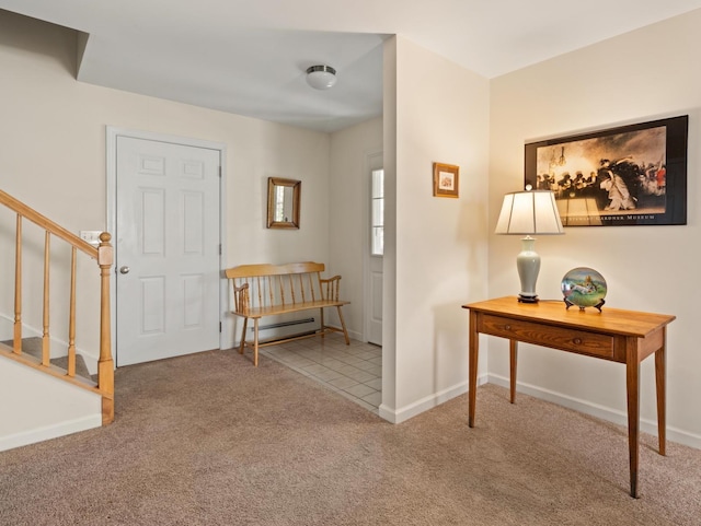 carpeted entrance foyer featuring baseboards and stairs