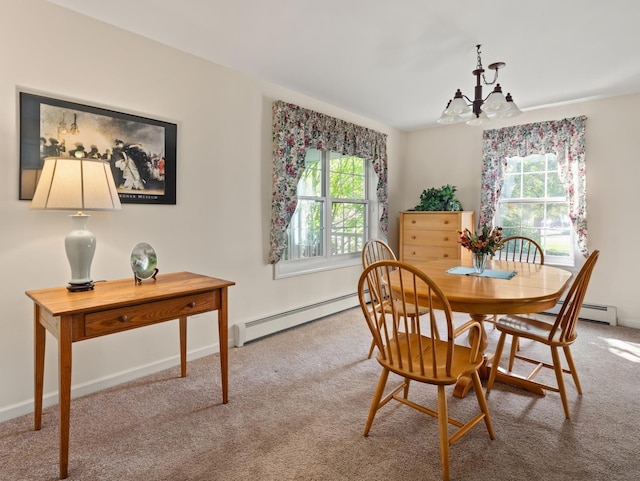 dining space with a notable chandelier, carpet flooring, a wealth of natural light, and a baseboard radiator