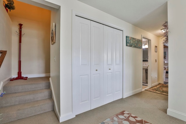 stairs with carpet and baseboards