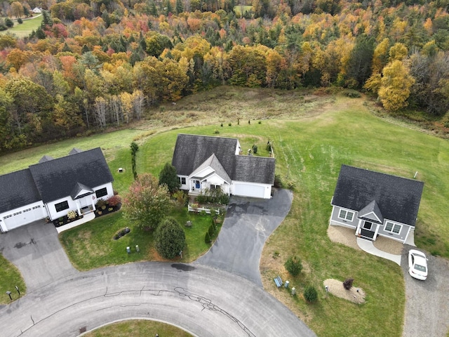 drone / aerial view featuring a view of trees