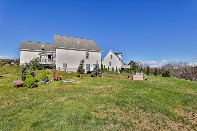 view of yard with a fire pit