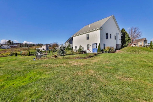 rear view of house with a lawn