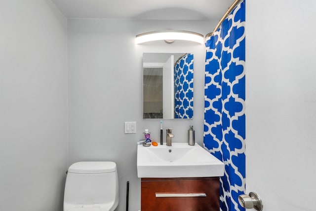 bathroom with vanity and toilet