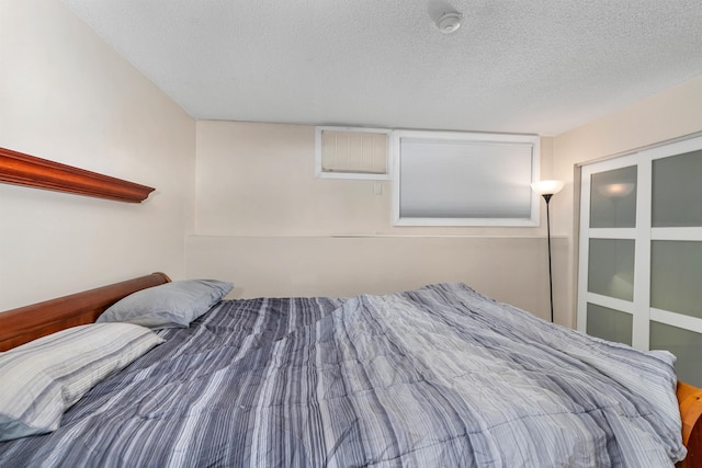 bedroom featuring a textured ceiling