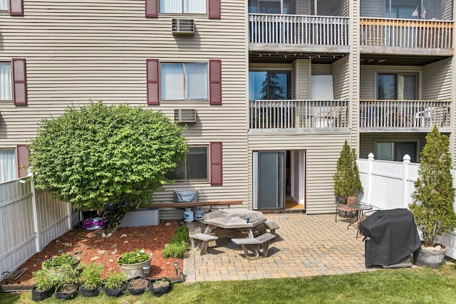 exterior space featuring a patio area and fence