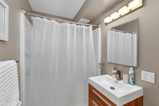 full bath with vanity and a shower with shower curtain