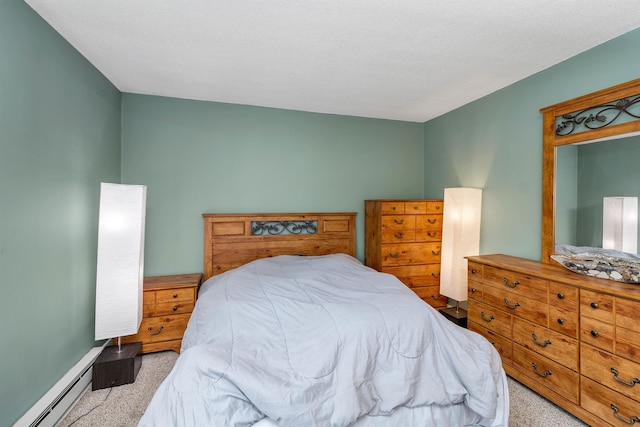 carpeted bedroom with baseboard heating