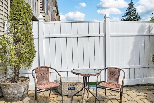 view of patio / terrace featuring fence