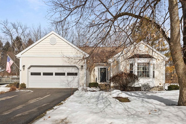 view of front of property with a garage and driveway