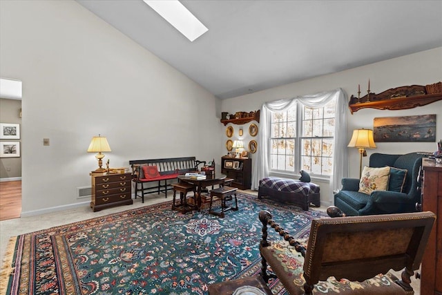 living room featuring visible vents, baseboards, carpet floors, a skylight, and high vaulted ceiling