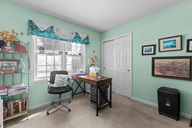 home office featuring baseboards and carpet floors