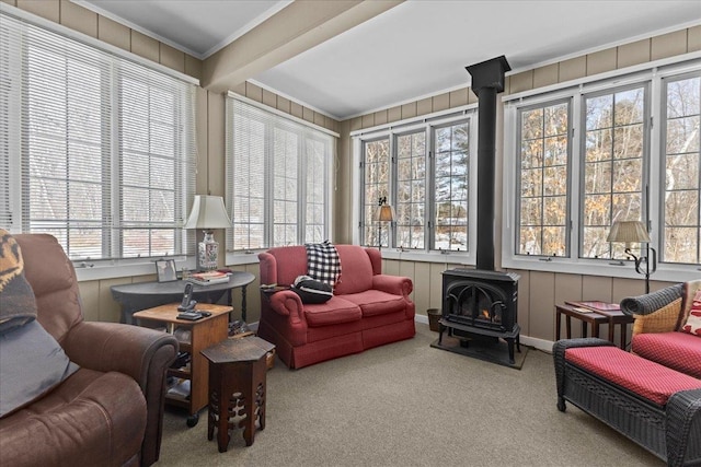 sunroom / solarium featuring a wood stove