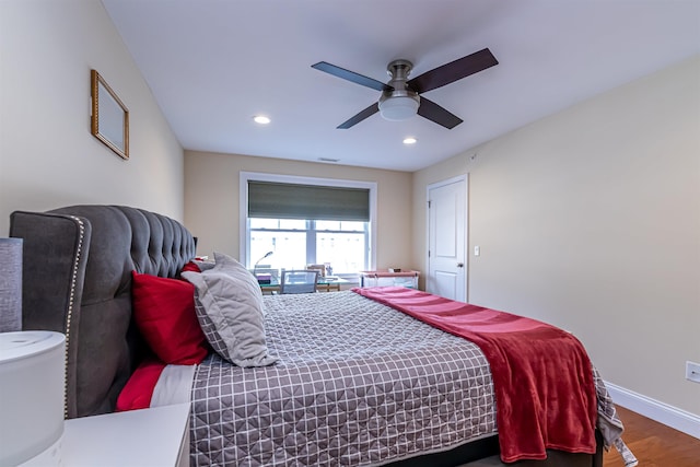 bedroom featuring recessed lighting, a ceiling fan, baseboards, and wood finished floors