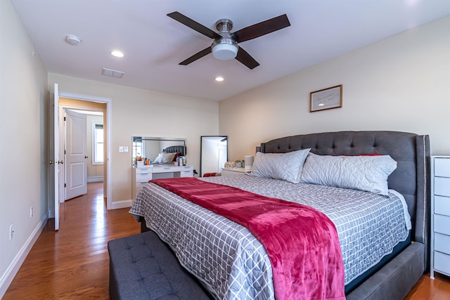 bedroom featuring visible vents, recessed lighting, baseboards, and wood finished floors