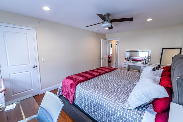 bedroom featuring visible vents, a ceiling fan, wood finished floors, recessed lighting, and baseboards