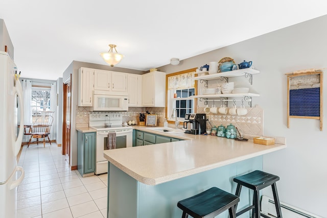 kitchen featuring a sink, open shelves, tasteful backsplash, white appliances, and a peninsula