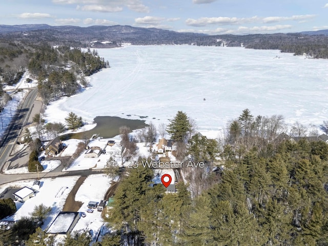 snowy aerial view with a mountain view