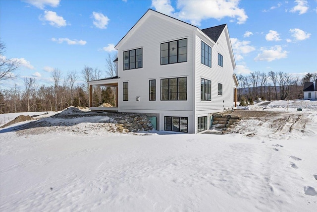 view of snow covered house