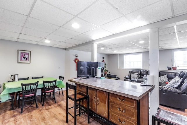 interior space featuring a wealth of natural light, open floor plan, and light wood finished floors