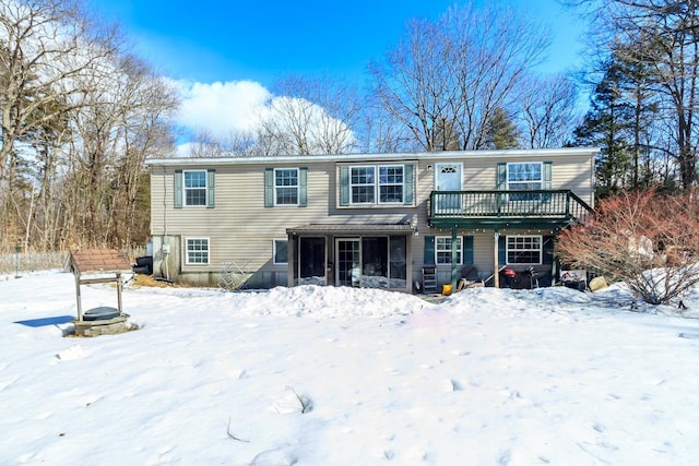 view of front of home featuring a sunroom