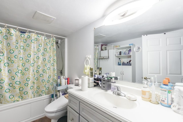 bathroom featuring shower / bath combination with curtain, vanity, and toilet