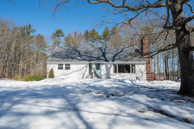 view of front of property featuring a chimney