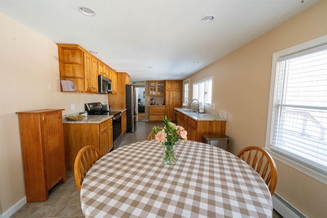 dining room featuring recessed lighting, baseboards, and baseboard heating