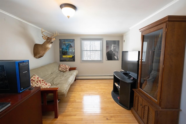 living room featuring a baseboard heating unit, crown molding, and light wood finished floors