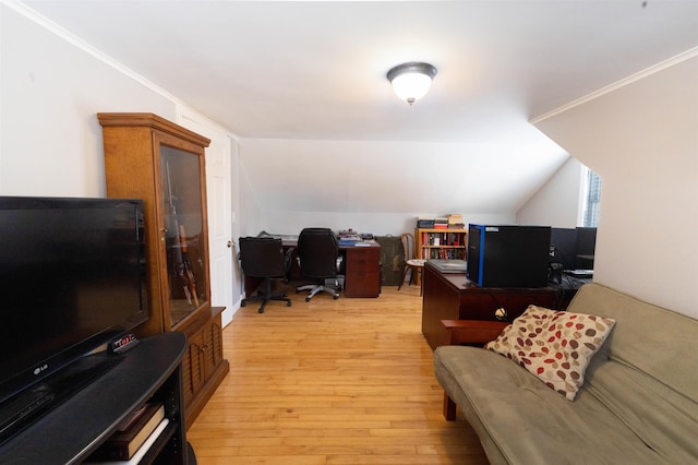 office space featuring crown molding, lofted ceiling, and light wood-style floors